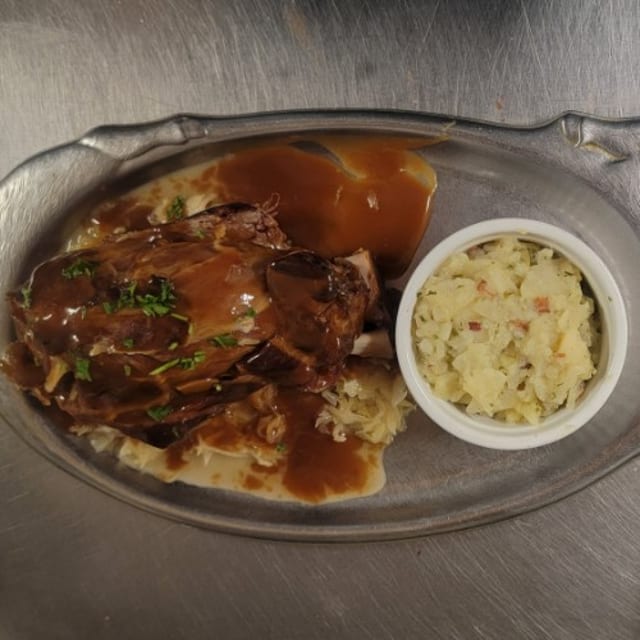 Smoked Pork Shank Over Sauerkraut.